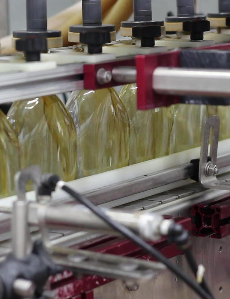 Glass maple syrup bottles being packaged