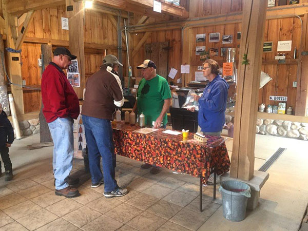 Figure 3: Members of the Maple Producers of Northeast Ohio conducting syrup grade-tasting at the Great Geauga County Fair. Photo by Les Ober, Extension Educator Ohio State University Extension, Geauga County.